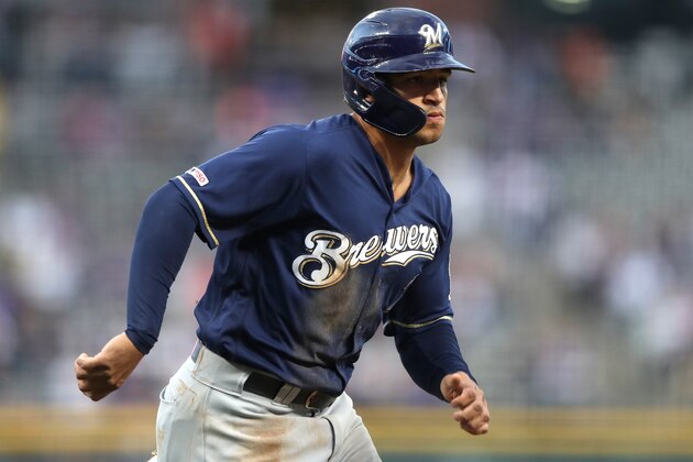 DENVER, COLORADO - SEPTEMBER 27: Trent Grisham #2 of the Milwaukee Brewers scores on a Ryan Braun single in the first inning against the Colorado Rockies at Coors Field on September 27, 2019 in Denver, Colorado. (Photo by Matthew Stockman/Getty Images)