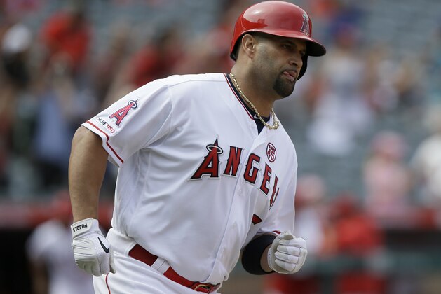 Los Angeles Angels designated hitter Albert Pujols rounds first after hitting a three-run home run during the fifth inning of a baseball game against the Tampa Bay Rays in Anaheim, Calif., Sunday, Sept. 15, 2019. (AP Photo/Alex Gallardo)