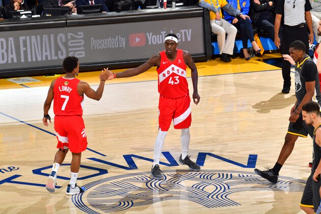 OAKLAND, CA - JUNE 7: Kyle Lowry #7 of the Toronto Raptors and Pascal Siakam #43 of the Toronto Raptors high-five during a game against the Golden State Warriors during Game Four of the NBA Finals on June 7, 2019 at ORACLE Arena in Oakland, California. NOTE TO USER: User expressly acknowledges and agrees that, by downloading and/or using this photograph, user is consenting to the terms and conditions of Getty Images License Agreement. Mandatory Copyright Notice: Copyright 2019 NBAE (Photo by Jesse D. Garrabrant/NBAE via Getty Images)