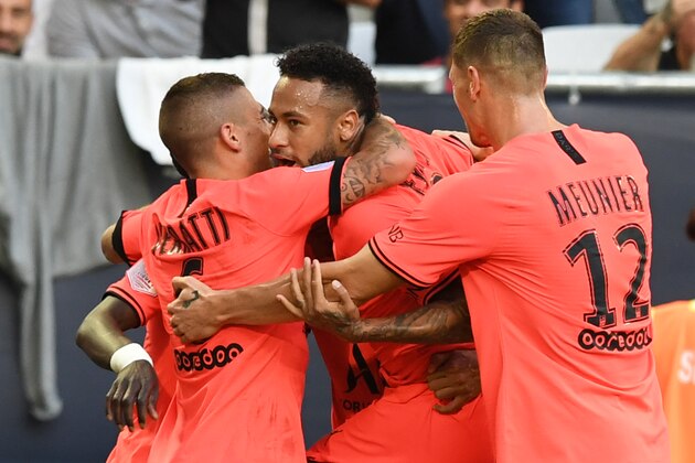 Paris Saint-Germain's Brazilian forward Neymar (C) is congratulated by teammates after scoring a goal during the French L1 football match between Girondins de Bordeaux and Paris Saint-Germain (PSG) on September 28, 2019 in Bordeaux. (Photo by MEHDI FEDOUACH / AFP)        (Photo credit should read MEHDI FEDOUACH/AFP/Getty Images)