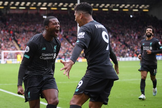 SHEFFIELD, ENGLAND - SEPTEMBER 28:  Georginio Wijnaldum of Liverpool celebrates with teammate after scoring his team's first goalduring the Premier League match between Sheffield United and Liverpool FC at Bramall Lane on September 28, 2019 in Sheffield, United Kingdom. (Photo by Laurence Griffiths/Getty Images)