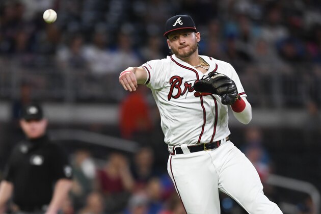 Atlanta Braves third baseman Josh Donaldson throws out New York Mets Ruben Tejada at first base during a baseball game Wednesday, Aug.14, 2019, in Atlanta. (AP Photo/John Amis)