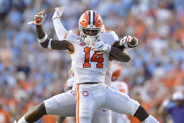 CHAPEL HILL, NORTH CAROLINA - SEPTEMBER 28: Denzel Johnson #14 and Nyles Pinckney #44 of the Clemson Tigers celebrate after stopping a two-point conversion attempt by the North Carolina Tar Heels during the fourth quarter of their game at Kenan Stadium on September 28, 2019 in Chapel Hill, North Carolina. Clemson won 21-20. (Photo by Grant Halverson/Getty Images)