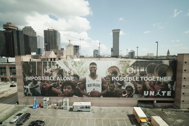NEW ORLEANS, LOUISIANA - SEPTEMBER 09: NBA players, Zion Williamson (front) and Lonzo Ball of the New Orleans Pelicans walk on the field before the game between the New Orleans Saints and the Houston Texans at Mercedes Benz Superdome on September 09, 2019 in New Orleans, Louisiana. (Photo by Chris Graythen/Getty Images)