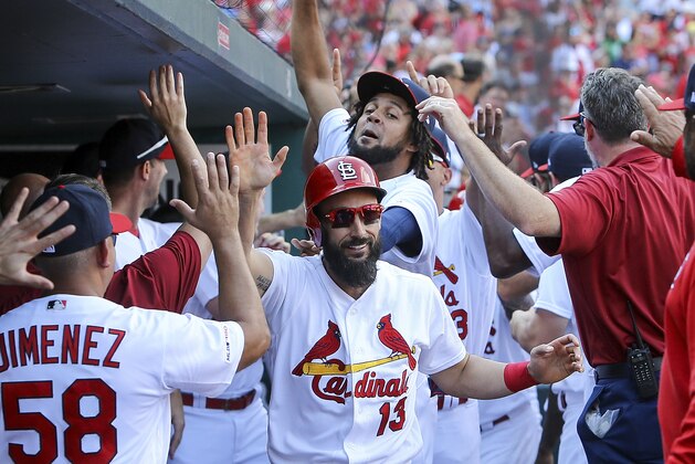 St. Louis Cardinals' Matt Carpenter, center, is congratulated by teammates after hitting a three-run home run during the third inning of a baseball game against the Chicago Cubs Sunday, Sept. 29, 2019, in St. Louis. (AP Photo/Scott Kane)