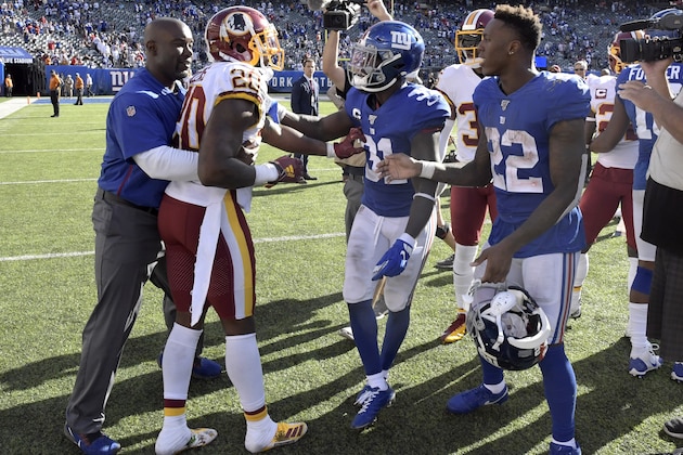 Washington Redskins strong safety Landon Collins (20) gets into a confrontation with New York Giants defensive back Michael Thomas (31) and running back Wayne Gallman (22) after an NFL football game, Sunday, Sept. 29, 2019, in East Rutherford, N.J. The Giants defeated the Redskins 24-3. (AP Photo/Bill Kostroun)