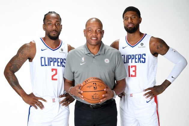 PLAYA VISTA, CA - SEPTEMBER 29: Kawhi Leonard #2, Head Coach Doc Rivers, and Paul George #13 of the LA Clippers pose for a portrait during media day on September 29, 2019 at the Honey Training Center: Home of the LA Clippers in Playa Vista, California. NOTE TO USER: User expressly acknowledges and agrees that, by downloading and/or using this photograph, user is consenting to the terms and conditions of the Getty Images License Agreement. Mandatory Copyright Notice: Copyright 2019 NBAE (Photo by Andrew D. Bernstein/NBAE via Getty Images)
