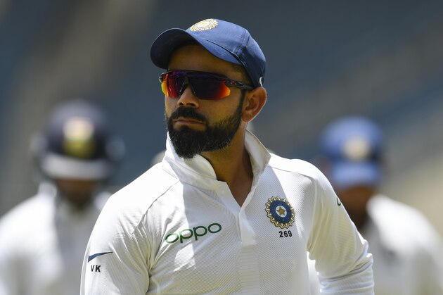 Virat Kohli of India walks off the field at the lunch break during day 4 of the 2nd Test between West Indies and India at Sabina Park, Kingston, Jamaica, on September 2, 2019. (Photo by Randy Brooks / AFP)        (Photo credit should read RANDY BROOKS/AFP/Getty Images)