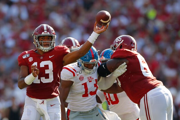 TUSCALOOSA, ALABAMA - SEPTEMBER 28:  Tua Tagovailoa #13 of the Alabama Crimson Tide escapes the pocket as he looks to pass against the Mississippi Rebels at Bryant-Denny Stadium on September 28, 2019 in Tuscaloosa, Alabama. (Photo by Kevin C. Cox/Getty Images)