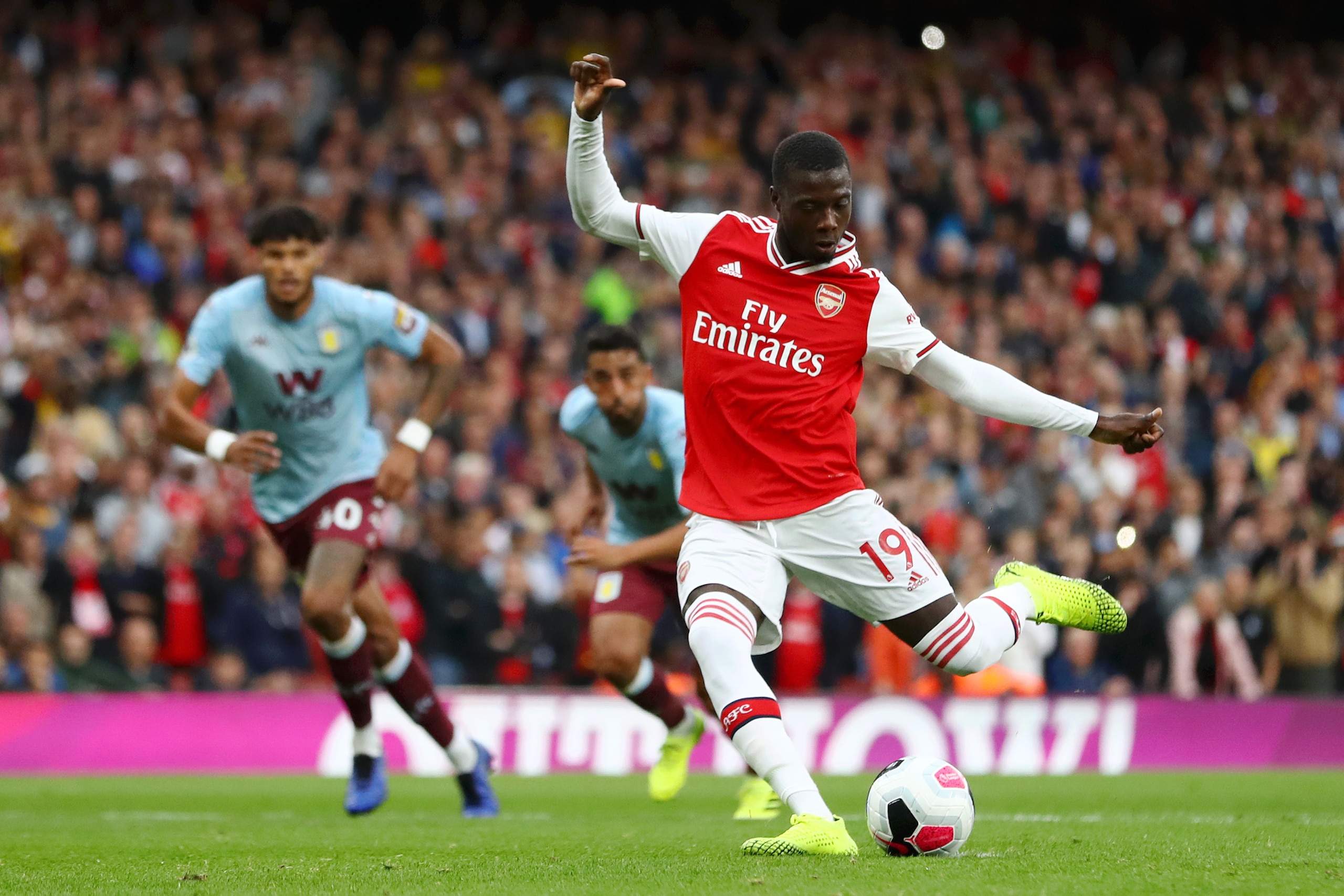 LONDON, ENGLAND - SEPTEMBER 22: Nicolas Pepe of Arsenal scores his team's first goal during the Premier League match between Arsenal FC and Aston Villa at Emirates Stadium on September 22, 2019 in London, United Kingdom. (Photo by Michael Steele/Getty Images) LONDON, ENGLAND - SEPTEMBER 22: Nicolas Pepe of Arsenal scores his team's first goal during the Premier League match between Arsenal FC and Aston Villa at Emirates Stadium on September 22, 2019 in London, United Kingdom. (Photo by Michael Steele/Getty Images)