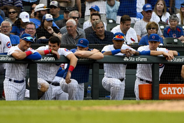 Chicago Cubs first baseman Anthony Rizzo, right, and other members of the team look on from the dugout during the ninth inning of a baseball game against the St. Louis Cardinals Friday, Sept. 20, 2019, in Chicago. (AP Photo/Matt Marton)