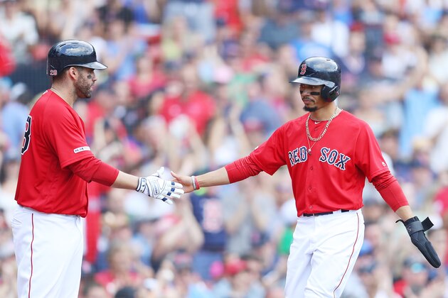 BOSTON, MASSACHUSETTS - AUGUST 18: Mookie Betts #50 of the Boston Red Sox celebrates with J.D. Martinez #28 after scoring a run against the Baltimore Orioles during the sixth inning at Fenway Park on August 18, 2019 in Boston, Massachusetts. (Photo by Maddie Meyer/Getty Images)