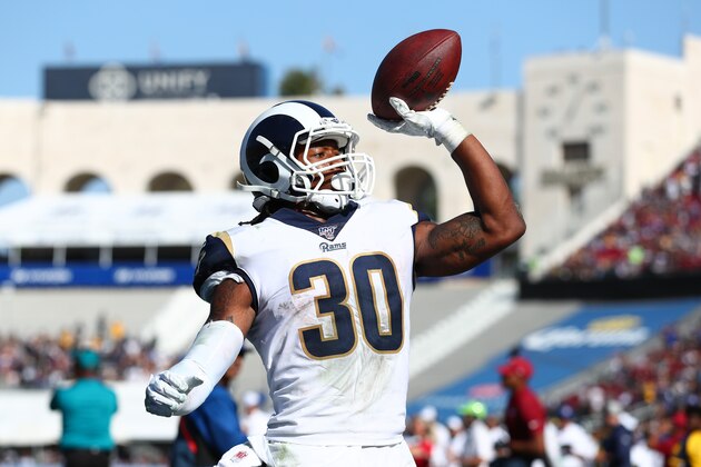 LOS ANGELES, CALIFORNIA - SEPTEMBER 29: Todd Gurley #30 of the Los Angeles Rams throws the ball into the crowd after scoring a touchdown in the fourth quarter against the Tampa Bay Buccaneers at Los Angeles Memorial Coliseum on September 29, 2019 in Los Angeles, California. (Photo by Joe Scarnici/Getty Images)