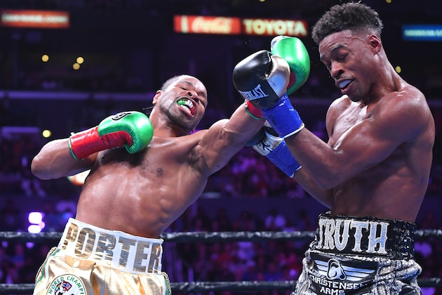 LOS ANGELES, CA - SEPTEMBER 28: Erroll Spence Jr (black/white trunks) and Shawn Porter (white/gold trunks) exchange punches during their IBF & WBC World Welterweight Championship fight at Staples Center on September 28, 2019 in Los Angeles, California. Spence, Jr won by decision. (Photo by Jayne Kamin-Oncea/Getty Images)
