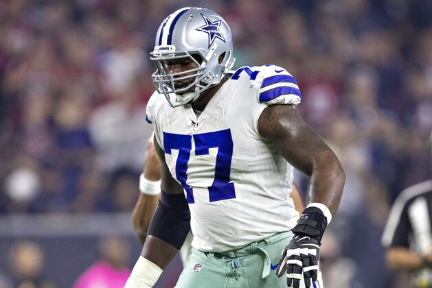 HOUSTON, TX - OCTOBER 7:  Tyron Smith #77 of the Dallas Cowboys at the line of scrimmage during a game against the Houston Texans at NRG Stadium on October 7, 2018 in Houston, Texans.  The Texans defeated the Cowboys in overtime 19-16.  (Photo by Wesley Hitt/Getty Images)
