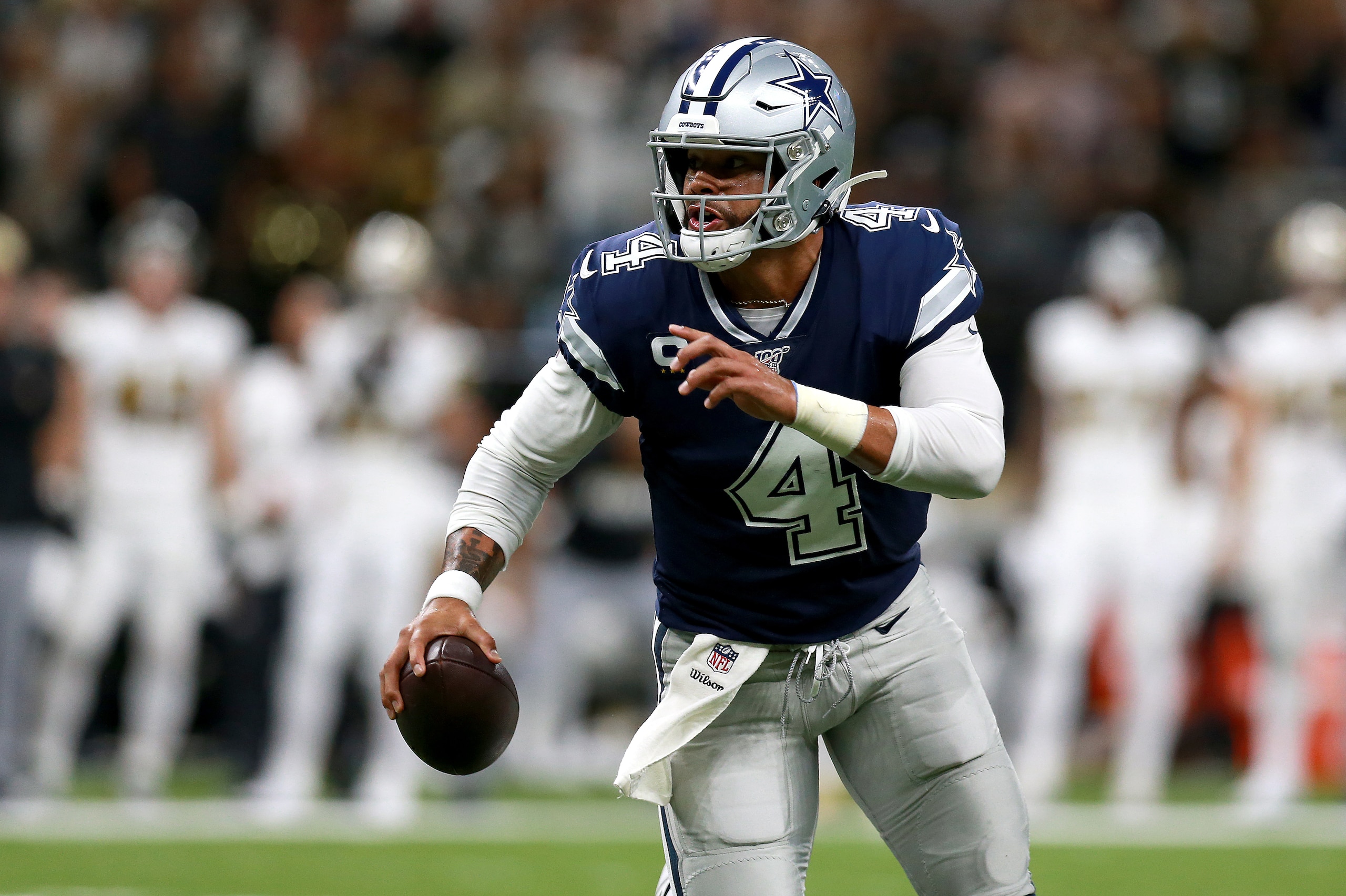 NEW ORLEANS, LOUISIANA - SEPTEMBER 29: Dak Prescott #4 of the Dallas Cowboys scrambles out ot the pocket during the first half of a NFL game against the New Orleans Saints at the  Mercedes Benz Superdome on September 29, 2019 in New Orleans, Louisiana. (Photo by Sean Gardner/Getty Images)