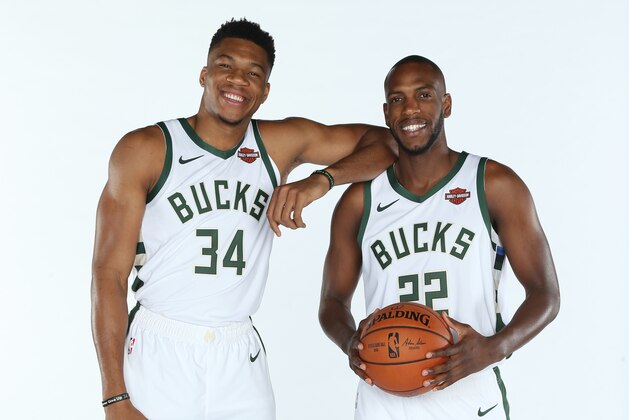 MILWAUKEE, WI - SEPTEMBER 30: Giannis Antetokounmpo #34 and Khris Middleton #22 of the Milwaukee Bucks pose for a portrait during Media Day at Fiserv Forum on September 30, 2019 in Milwaukee, Wisconsin. NOTE TO USER: User expressly acknowledges and agrees that, by downloading and/or using this photograph, user is consenting to the terms and conditions of the Getty Images License Agreement.  Mandatory Copyright Notice: Copyright 2019 NBAE (Photo by Gary Dineen/NBAE via Getty Images)