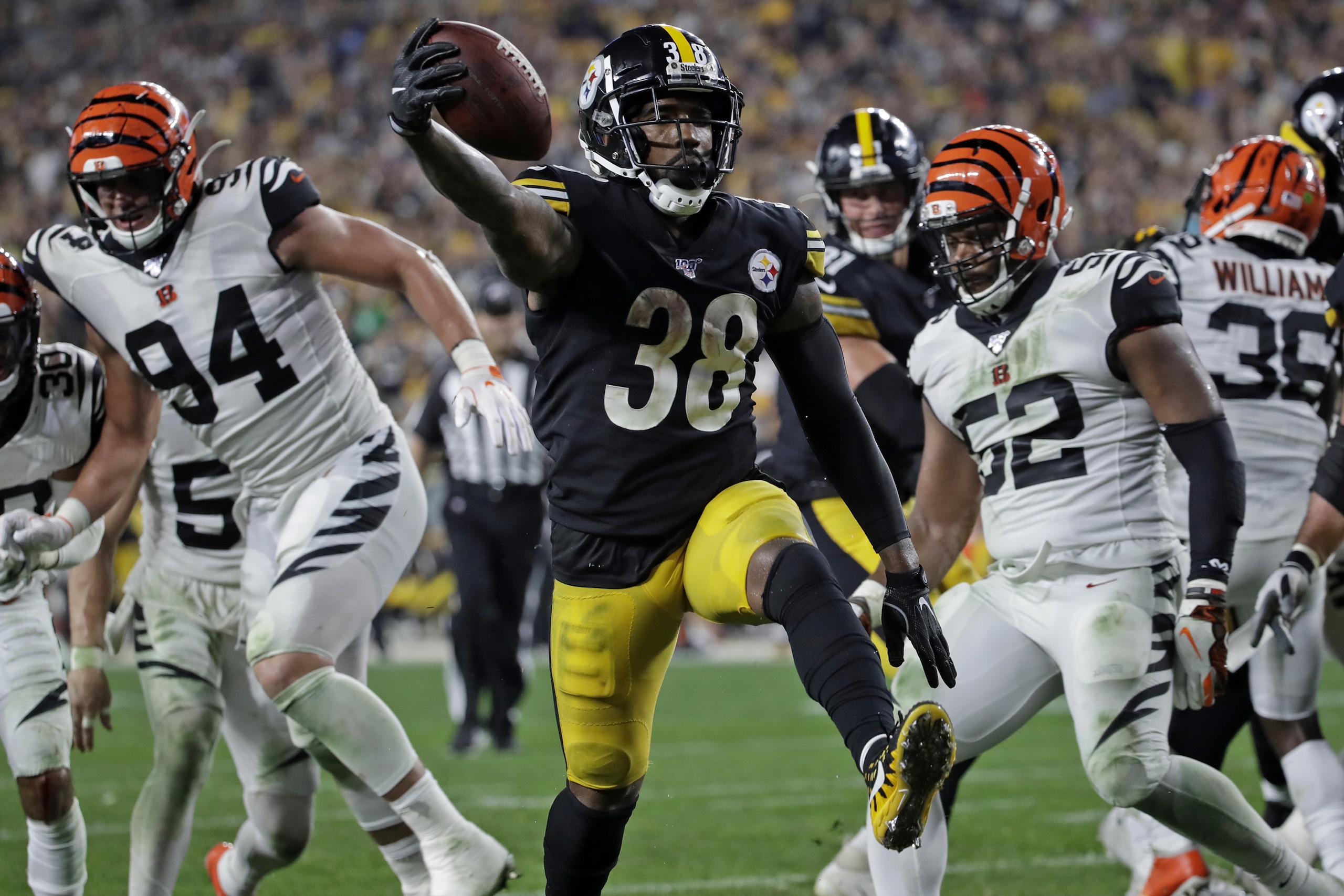 Pittsburgh Steelers running back Jaylen Samuels (38) scores on a 2-yard run during the second half of an NFL football game against the Cincinnati Bengals in Pittsburgh, Monday, Sept. 30, 2019. (AP Photo/Don Wright)