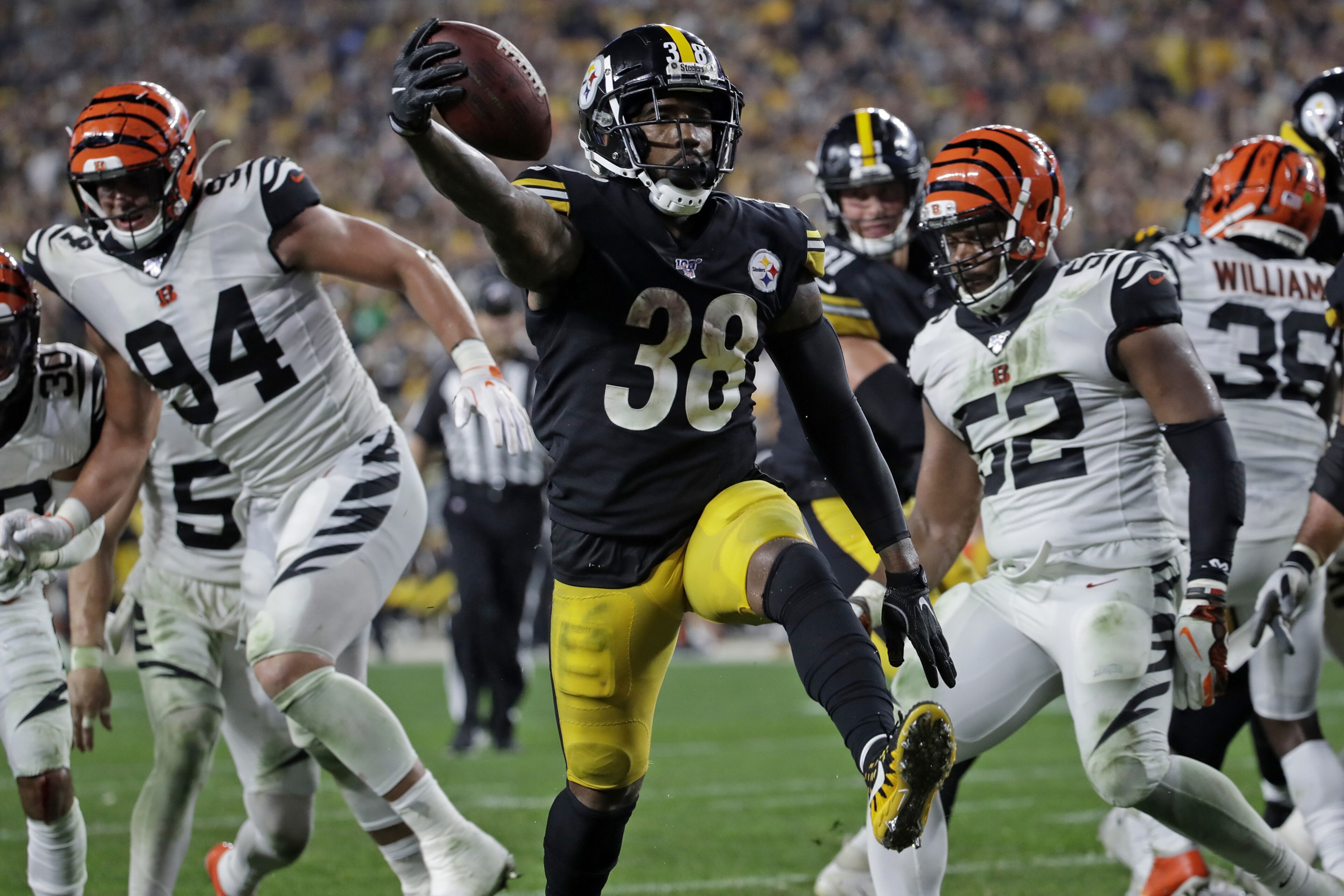 Pittsburgh Steelers running back Jaylen Samuels (38) scores on a 2-yard run during the second half of an NFL football game against the Cincinnati Bengals in Pittsburgh, Monday, Sept. 30, 2019. (AP Photo/Don Wright)