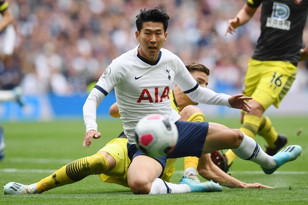 LONDON, ENGLAND - SEPTEMBER 28: Heung-Min Son of Tottenham Hotspur is tackled by Jan Bednarek of Southampton during the Premier League match between Tottenham Hotspur and Southampton FC at Tottenham Hotspur Stadium on September 28, 2019 in London, United Kingdom. (Photo by Alex Davidson/Getty Images)