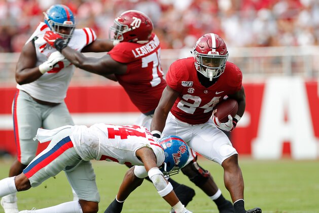 TUSCALOOSA, ALABAMA - SEPTEMBER 28:  Brian Robinson Jr. #24 of the Alabama Crimson Tide attempts to break a tackle by Deantre Prince #24 of the Mississippi Rebels at Bryant-Denny Stadium on September 28, 2019 in Tuscaloosa, Alabama. (Photo by Kevin C. Cox/Getty Images)