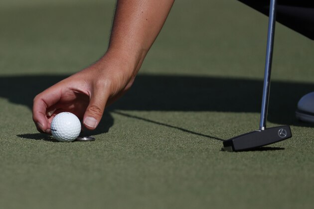 Sebastian Munoz, of Colombia, gently places his ball on the 16th green during the third round of the Sanderson Farms Championship golf tournament in Jackson, Miss., Saturday, Sept. 21, 2019. (AP Photo/Rogelio V. Solis)