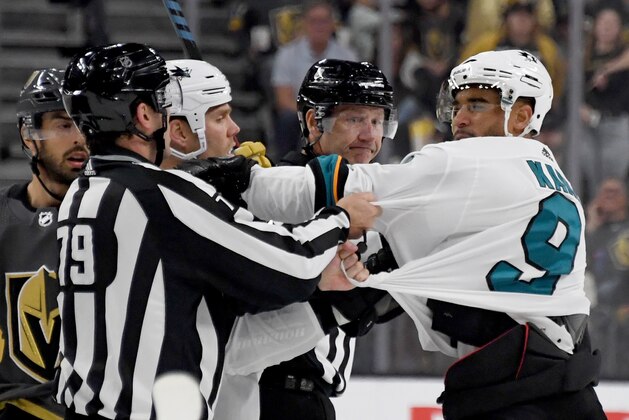 LAS VEGAS, NEVADA - SEPTEMBER 29:  Evander Kane #9 of the San Jose Sharks shoves linesman Kiel Murchison in the third period of the Sharks' preseason game against the Vegas Golden Knights at T-Mobile Arena on September 29, 2019 in Las Vegas, Nevada. Kane received a game misconduct for an abuse of officials penalty. The Golden Knights defeated the Sharks 5-1.  (Photo by Ethan Miller/Getty Images)