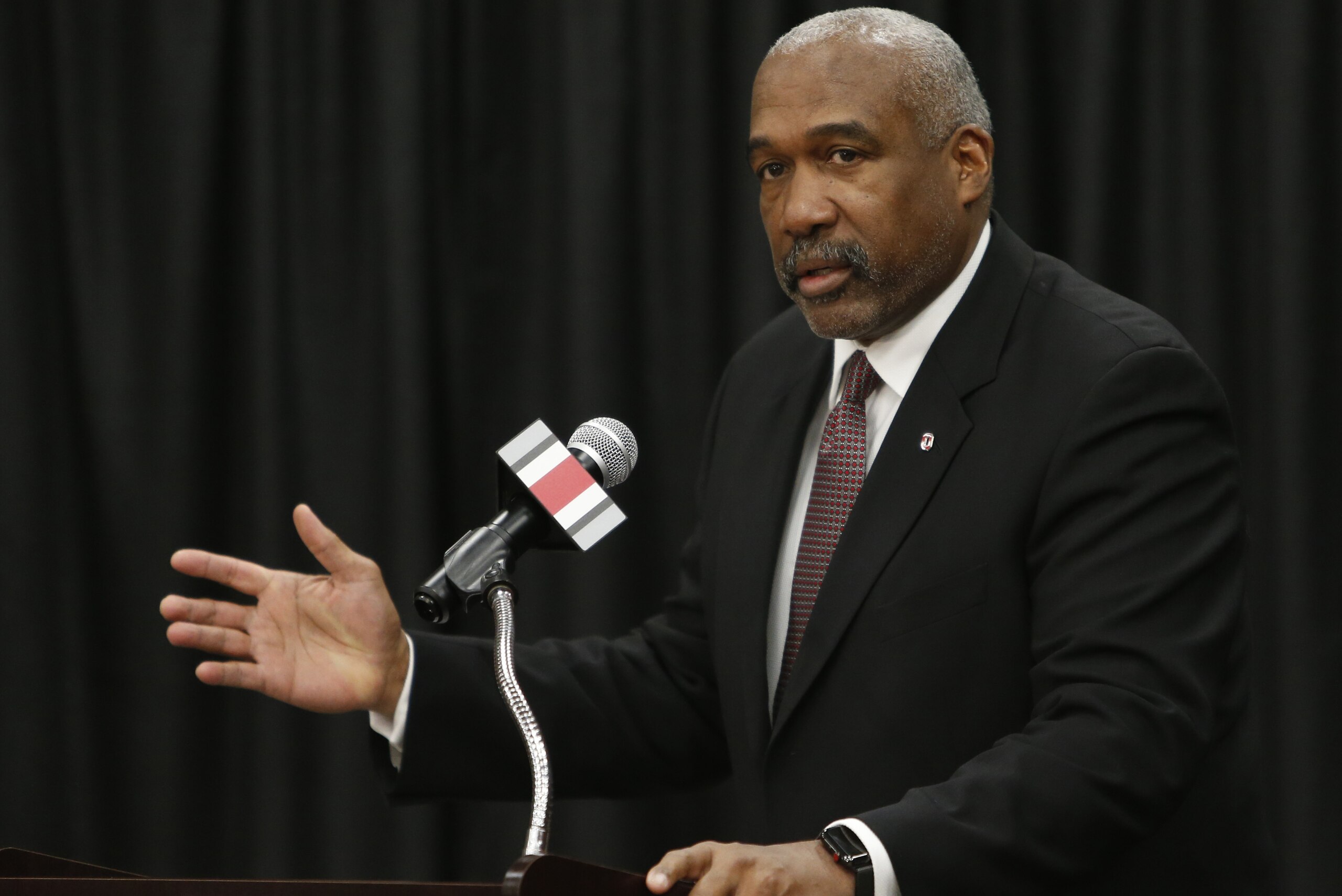 Ohio State athletics director Gene Smith answers questions during a news conference announcing the retirement of NCAA college football head coach Urban Meyer and the hiring of Meyer's replacement, Ryan Day, Tuesday, Dec. 4, 2018, in Columbus, Ohio. (AP Photo/Jay LaPrete)
