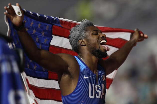 Noah Lyles of the U.S., celebrates winning the gold medal in the men's 200 meter final at the World Athletics Championships in Doha, Qatar, Tuesday, Oct. 1, 2019. (AP Photo/Petr David Josek)