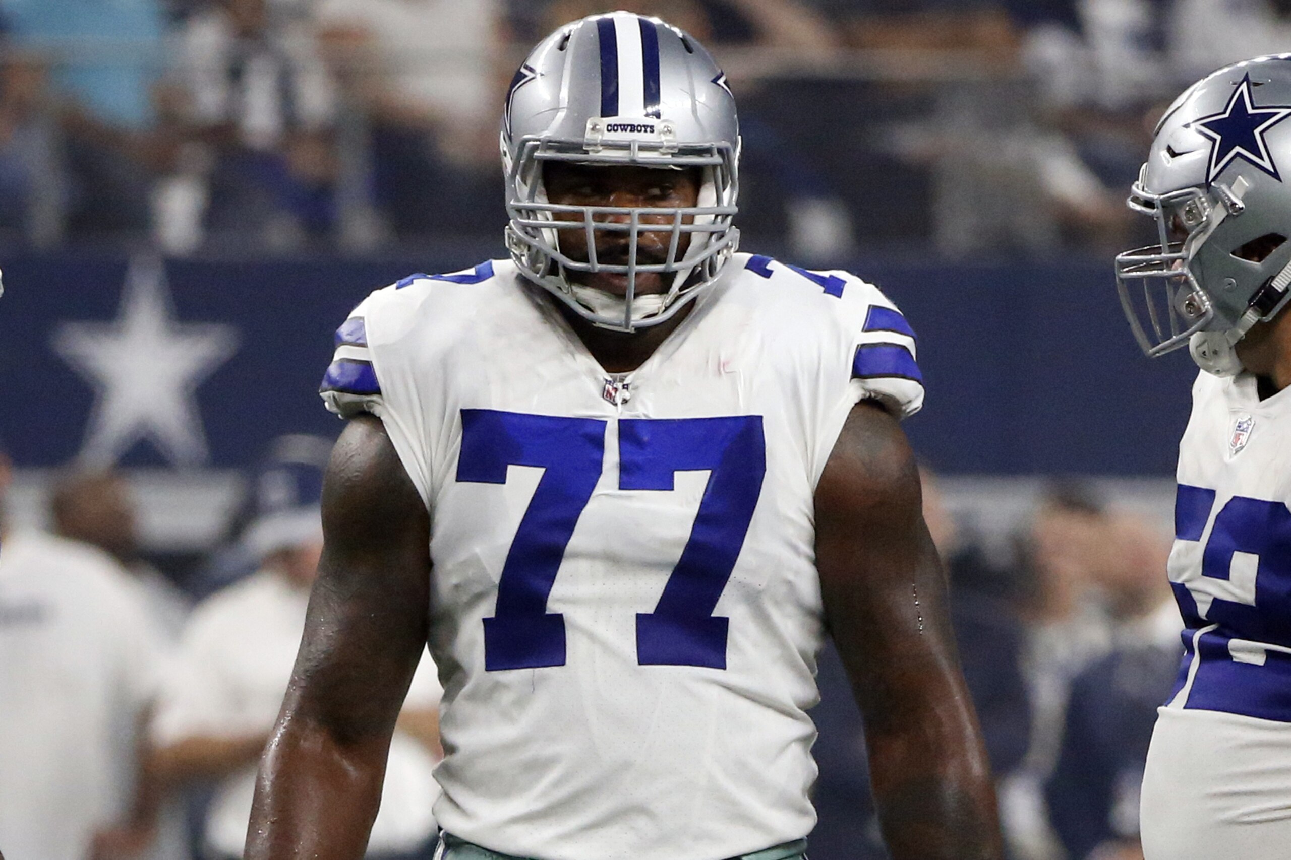 Dallas Cowboys offensive tackle Tyron Smith (77) prepares to line up against the New York Giants during the first half of an NFL football game in Arlington, Texas, Sunday, Sept. 16, 2018. (AP Photo/Michael Ainsworth) Dallas Cowboys offensive tackle Tyron Smith (77) prepares to line up against the New York Giants during the first half of an NFL football game in Arlington, Texas, Sunday, Sept. 16, 2018. (AP Photo/Michael Ainsworth)