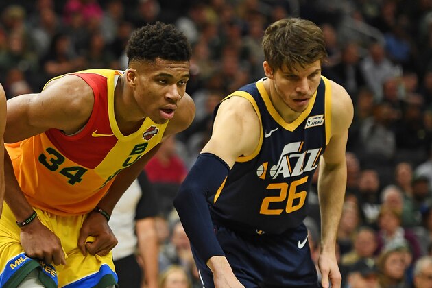 MILWAUKEE, WISCONSIN - JANUARY 07:  Giannis Antetokounmpo #34 of the Milwaukee Bucks is defended by Rudy Gobert #27 and Kyle Korver #26 of the Utah Jazz during a game at Fiserv Forum on January 07, 2019 in Milwaukee, Wisconsin. NOTE TO USER: User expressly acknowledges and agrees that, by downloading and or using this photograph, User is consenting to the terms and conditions of the Getty Images License Agreement. (Photo by Stacy Revere/Getty Images)