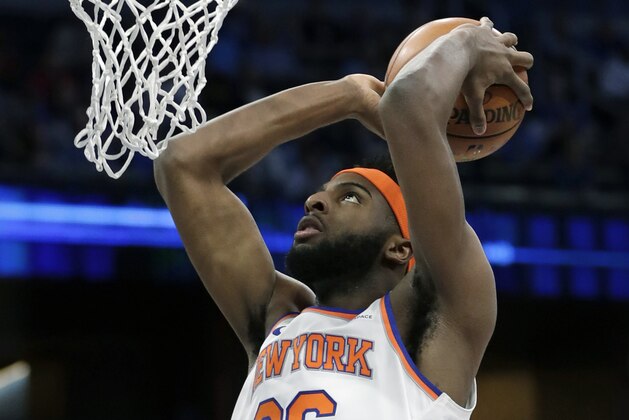 New York Knicks' Mitchell Robinson dunks the ball against the Orlando Magic during the first half of an NBA basketball game, Wednesday, April 3, 2019, in Orlando, Fla. (AP Photo/John Raoux)