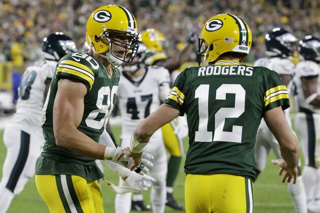 Green Bay Packers tight end Jimmy Graham (80) celebrates a touchdown with quarterback Aaron Rodgers (12) during the second half of the team's NFL football game against the Philadelphia Eagles on Thursday, Sept. 26, 2019, in Green Bay, Wis. (AP Photo/Mike Roemer)
