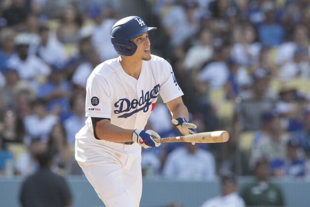 Los Angeles Dodgers' Corey Seager watches the ball clear the fence as he hits a home run against the Colorado Rockies during the seventh inning of a baseball game in Los Angeles, Sunday, Sept. 22, 2019. (AP Photo/Sam Gangwer)