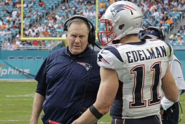 New England Patriots wide receiver Julian Edelman (11) talks to head coach Bill Belichick, during the second half of an NFL football game, Sunday, Jan. 1, 2017, in Miami Gardens, Fla. The Patriots defeated the Dolphins 35-14. (AP Photo/Alan Diaz)