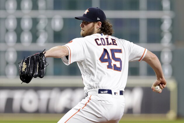 Houston Astros starting pitcher Gerrit Cole (45) throws against the Texas Rangers during the first inning of a baseball game Wednesday, Sept. 18, 2019, in Houston. (AP Photo/Michael Wyke)