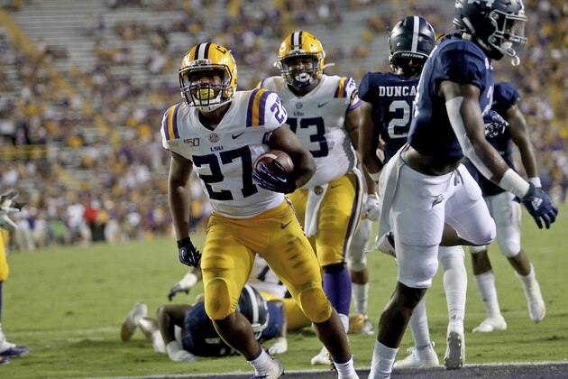 LSU running back Lanard Fournette (27) scores a third quarter touchdown against Georgia Southern during an NCAA college football game in Baton Rouge, La., Saturday, Aug. 31, 2019. (AP Photo/Michael Democker)