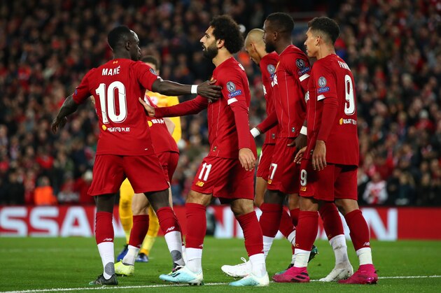 LIVERPOOL, ENGLAND - OCTOBER 02: Mohamed Salah of Liverpool celebrates with Sadio Mane after he scores his sides fourth goal during the UEFA Champions League group E match between Liverpool FC and RB Salzburg at Anfield on October 02, 2019 in Liverpool, United Kingdom. (Photo by Clive Brunskill/Getty Images)