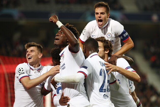 LILLE, FRANCE - OCTOBER 02: Willian of Chelsea celebrates with Tammy Abraham and team mates after scoring his sides second goal during the UEFA Champions League group H match between Lille OSC and Chelsea FC at Stade Pierre Mauroy on October 02, 2019 in Lille, France. (Photo by Bryn Lennon/Getty Images)