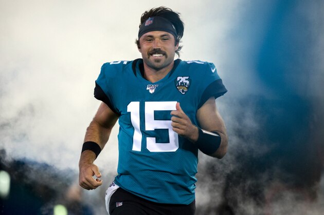 Jacksonville Jaguars quarterback Gardner Minshew (15) runs onto the field during the opening ceremonies of an NFL football game between the Jacksonville Jaguars and the Tennessee Titans, Thursday, Sept. 19, 2019, in Jacksonville, Fla. (AP Photo/Stephen B. Morton)