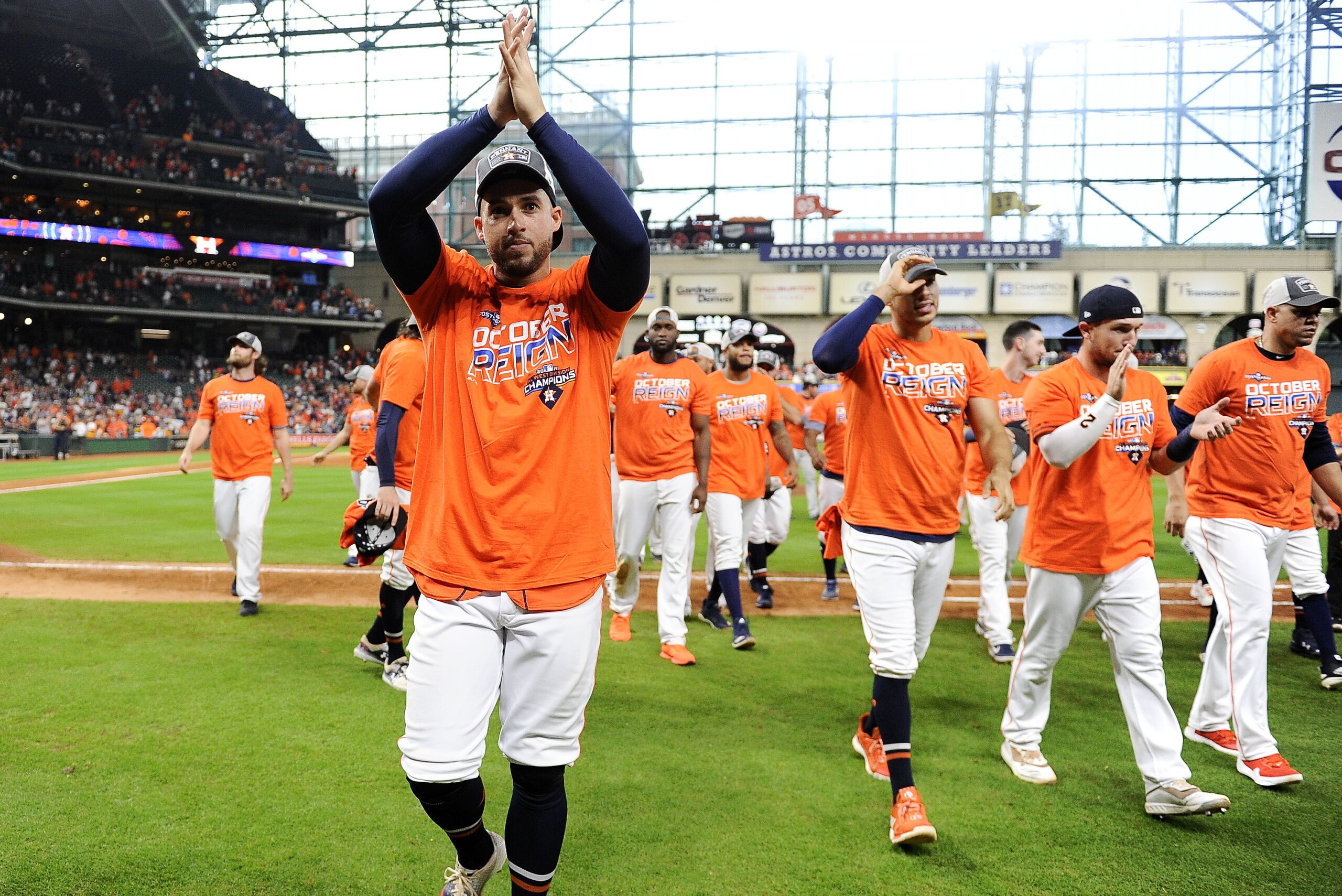 Houston Astros' George Springer, left, celebrates the team's clinching of the AL West crown after a baseball game against the Los Angeles Angels, Sunday, Sept. 22, 2019, in Houston. (AP Photo/Eric Christian Smith)