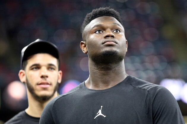 NEW ORLEANS, LOUISIANA - SEPTEMBER 09: NBA players, Zion Williamson (front) and Lonzo Ball of the New Orleans Pelicans walk on the field before the game between the New Orleans Saints and the Houston Texans at Mercedes Benz Superdome on September 09, 2019 in New Orleans, Louisiana. (Photo by Chris Graythen/Getty Images)