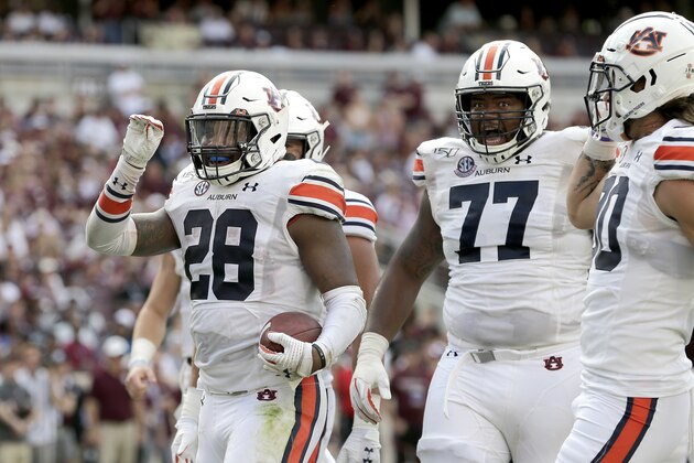 Auburn running back JaTarvious Whitlow (28) reacts after scoring a touchdown against Texas A&M during the second half of an NCAA college football game, Saturday, Sept. 21, 2019, in College Station, Texas. (AP Photo/Sam Craft)
