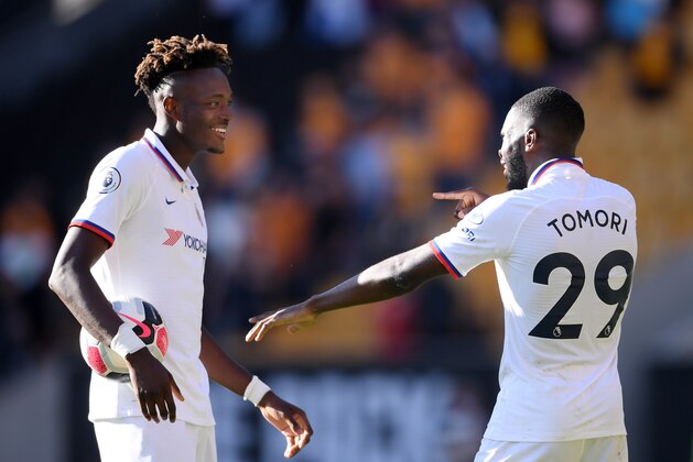 WOLVERHAMPTON, ENGLAND - SEPTEMBER 14: Tammy Abraham of Chelsea speaks with Fikayo Tomori after scoring a hat trick during the Premier League match between Wolverhampton Wanderers and Chelsea FC at Molineux on September 14, 2019 in Wolverhampton, United Kingdom. (Photo by Laurence Griffiths/Getty Images)