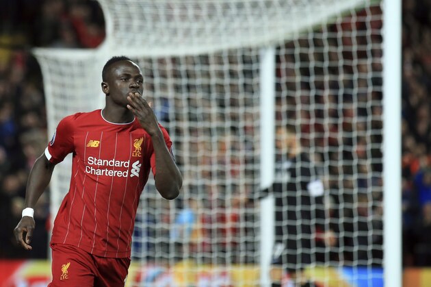 Liverpool's Sadio Mane celebrates after scoring his side's opening goal during the Champions League group E soccer match between Liverpool and Red Bull Salzburg at Anfield stadium in Liverpool, England, Wednesday, Oct. 2, 2019. (AP Photo/Jon Super)