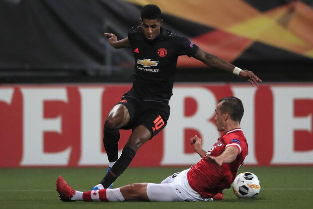 Manchester United's Marcus Rashford is tackled by Alkmaar's Stijn Wuytens during the group L Europa League soccer match between AZ Alkmaar and Manchester United at the ADO Den Haag stadium in The Hague, Netherlands, Thursday, Oct. 3, 2019. (AP Photo/Peter Dejong)