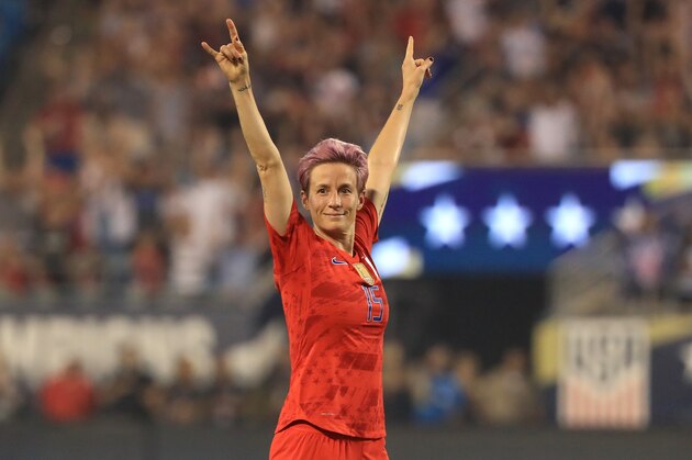CHARLOTTE, NORTH CAROLINA - OCTOBER 03: Megan Rapinoe #15 of United States reacts after a goal by teammate Allie Long #20 during their game against Korea Republic at Bank of America Stadium on October 03, 2019 in Charlotte, North Carolina. (Photo by Streeter Lecka/Getty Images)