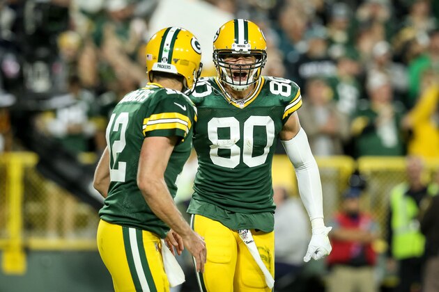 GREEN BAY, WISCONSIN - SEPTEMBER 26:  Aaron Rodgers #12 and Jimmy Graham #80 of the Green Bay Packers celebrate after scoring a touchdown in the third quarter against the Philadelphia Eagles at Lambeau Field on September 26, 2019 in Green Bay, Wisconsin. (Photo by Dylan Buell/Getty Images)