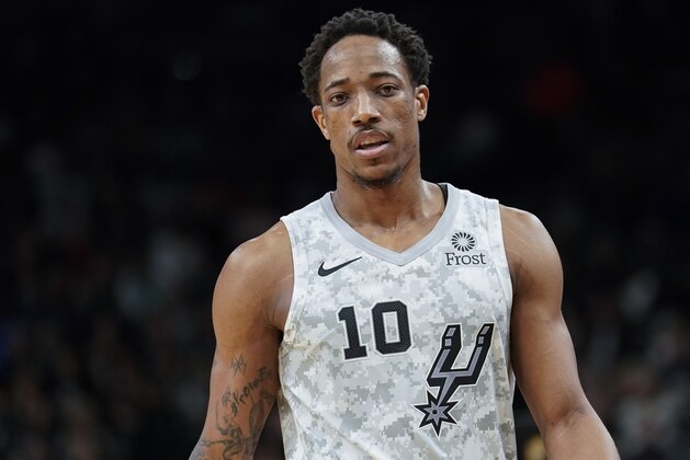 San Antonio Spurs guard DeMar DeRozan walks upcourt during the second half of an NBA basketball game against the Oklahoma City Thunder, Saturday, March 2, 2019, in San Antonio. San Antonio won 116-102. (AP Photo/Darren Abate)
