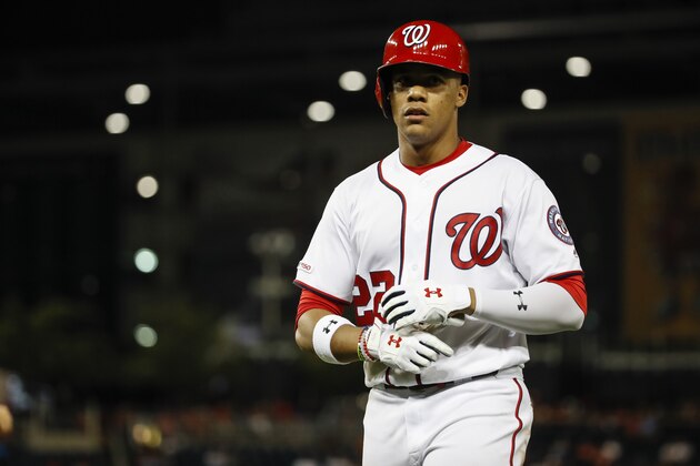 Washington Nationals left fielder Juan Soto (22) walks to the dugout during a baseball game against the Baltimore Orioles at Nationals Park Wednesday, Aug. 28, 2019, in Washington. The Nationals won 8-4. (AP Photo/Alex Brandon)
